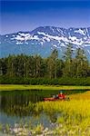 Fly fisherman in a kayak fishing in Portage Valley, Southcentral, Alaska, Summer