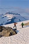 Hikers climb in the afternoon sun on a ridge above the Juneau Ice Field, Juneau, Alaska, Tongass National Forest