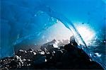 View of the entrance of an ice cave in Mendenhall Glacier, Juneau, Southeast Alaska, Summer