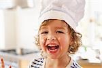 Young boy with flour in his face