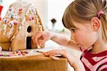 young girl preparing cake house