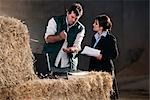 business woman advising farmer
