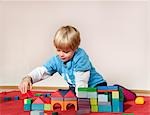 boy with toy building blocks