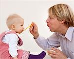 father feeding baby