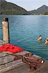 A couple bathing naked in a lake