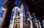 Mexico,Yucatan,Campeche. The cathedral in Campeche seen from the arcade surrounding the Plaza de Armas.