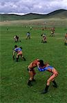 Mongolia,Ulan Bator. Boys competing in a wrestling competition at the National Day (Naadam) celebrations known as the 'three manly games'.