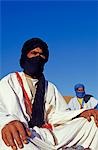 Berber tribesmen in the sand dunes of the Erg Chegaga,in the Sahara region of Morocco.