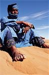 Berber tribesman in the sand dunes of the Erg Chegaga,in the Sahara region of Morocco.