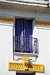 Blue shutters on the colonial facade of the Hotel Central in the old medina of Morocco