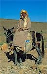 Morocco,Anti-Atlas Mountains. A Berber man pauses on his mule on the way to his home village.