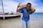 Unloading a dhow in the harbour of Ibo Island,part of the Quirimbas Archipelago,Mozambique