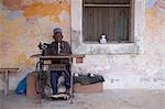 A man works his sewing machine on Ibo Island,part of the Quirimbas Archipelago,Mozambique