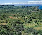 Fertile farming country on the slopes of the Rift Valley Escarpment to the west of Lake Malawi. The Livingstone Mountains rise steeply the far side of the lake.
