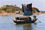 Myanmar,Burma,Kaladan River. A traditional sailing boat on the Kaladan River.