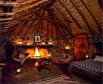 Bedroom at Sabuk,lit by lanterns & candles at night.