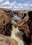 Rock sculpturing by the Galana River at Lugard Falls in Tsavo East National Park. The falls are named after Lord Lugard who,as a young army captain,journeyed through the region in 1890,leading a caravan for 800 miles to the Kingdom of Buganda in the country we know today as Uganda.