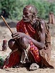 The proud father of a Samburu boy who has recently been circumcised. For each son who has been initiated into the warrior age-set,a father will tie a strip of lion skin below his knees,hang two copper ornaments normally worn by women in his pierced earlobes and places a string of pale green beads round his forehead. A ceremonial leather cape is slung over his shoulder.