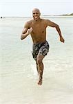 Man running through surf