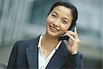 Businesswoman using cell phone