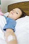 Child lying in hospital bed