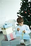Boy opening Christmas presents