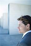 Young businessman looking away, profile, head and shoulders, portrait