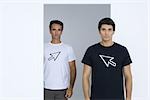 Two men wearing tee-shirts printed with computer cursors