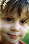 Little boy smiling at camera, headshot, portrait