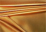 Folded gold fabric, close-up, full frame