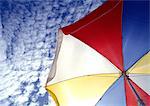 Beach parasol and sky, low angle view