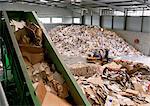 Piles of used cardboard in recycling center