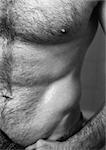 Man's bare torso, partial view, close-up, b&w