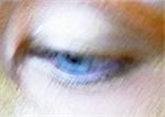 Woman's blue eye looking down, blurred close up.