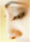 Woman's lowered eye, close-up