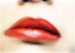 Woman's mouth with red lipstick, blurred, extreme close-up