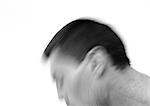 Man's head in motion, side view, blurred