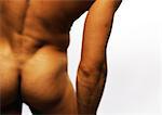 Nude man's buttocks and arm, close-up