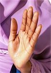 Woman's palm held up in prayer, close-up