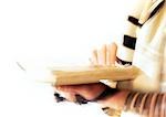 Hands of Jewish man holding Torah