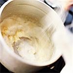Close-up of bechamel sauce being cooked in a pot