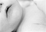 Baby's lower face and chest, close-up, b&w