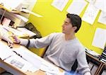 Man working at desk, blurred