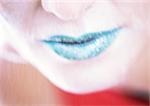 Woman's lips with green lipstick, close-up