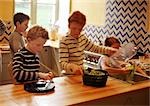 Children in kitchen, blurred