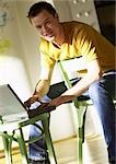 Man using laptop computer, portrait