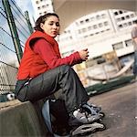 Young woman wearing inline skates, portrait