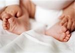 Baby's feet and hands, close-up