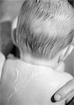 Baby with wet hair and back, rear view, close-up, b&w