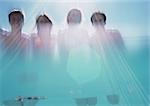 Two men and two women, low angle view, shot from underwater